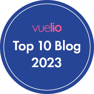Blue circular badge graphic with text overlaid that reads Vuelio Top 10 Blog 2023